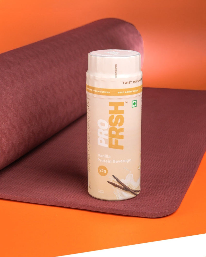 Pro Frsh vanilla shake on a yoga mat after a workout